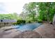 This home has an in-ground pool with a diving board for summer fun at 2923 Bicentennial Dr, Stone Mountain, GA 30087