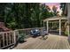 Tranquil back deck featuring outdoor seating, a gazebo, and serene views of the surrounding greenery at 4586 Smoke Rise Ln, Marietta, GA 30062