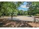 Outdoor basketball court surrounded by trees, offering a great space for sports and recreation at 4586 Smoke Rise Ln, Marietta, GA 30062