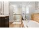 Modern bathroom with a glass-enclosed shower, soaking tub, and dual vanity sinks, creating a functional and stylish space at 4586 Smoke Rise Ln, Marietta, GA 30062
