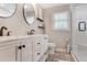 Well-lit bathroom featuring dual sinks, stylish fixtures, and a shower, designed for convenience and comfort at 4586 Smoke Rise Ln, Marietta, GA 30062