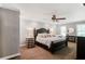 Serene bedroom with a comfortable bed, ceiling fan, and natural light creating a peaceful retreat at 4586 Smoke Rise Ln, Marietta, GA 30062