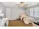 Bright bedroom with a comfortable bed, natural light, and a peaceful ambiance, ideal for rest and relaxation at 4586 Smoke Rise Ln, Marietta, GA 30062