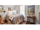 Comfortable bedroom with a warm quilt and a side table with decor at 4586 Smoke Rise Ln, Marietta, GA 30062
