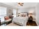 Inviting bedroom featuring a comfortable bed, natural light, and tasteful decor for a restful retreat at 4586 Smoke Rise Ln, Marietta, GA 30062