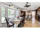 Bright dining area featuring large windows, stylish lighting, and easy access to the kitchen at 4586 Smoke Rise Ln, Marietta, GA 30062