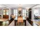 Formal dining room featuring stylish lighting, hardwood floors, and views into the entryway and living room at 4586 Smoke Rise Ln, Marietta, GA 30062