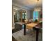 View of dining room featuring elegant lighting, wood floors, and a decorative rug at 4586 Smoke Rise Ln, Marietta, GA 30062