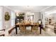 Formal dining room featuring stylish lighting, hardwood floors, and views into the entryway and living room at 4586 Smoke Rise Ln, Marietta, GA 30062