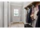 Charming entryway with white door and hardwood floors featuring a coat rack for a neat and inviting space at 4586 Smoke Rise Ln, Marietta, GA 30062