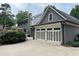 A two-car garage is adjacent to the house, with a well-maintained driveway and landscaping at 4586 Smoke Rise Ln, Marietta, GA 30062