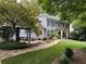 Charming two-story home with a brick facade, landscaped yard, and inviting front porch at 4586 Smoke Rise Ln, Marietta, GA 30062