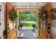 Inviting front porch view through double front doors, flanked by plants and a welcome mat at 4586 Smoke Rise Ln, Marietta, GA 30062