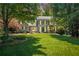 Beautiful gray brick home with a lush green lawn and mature trees in a desirable neighborhood at 4586 Smoke Rise Ln, Marietta, GA 30062