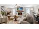 Cozy living room featuring shiplap walls, fireplace, stylish furnishings, and an abundance of natural light at 4586 Smoke Rise Ln, Marietta, GA 30062
