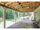Covered patio offers string lights, a ceiling and outdoor seating perfect for entertaining at 4586 Smoke Rise Ln, Marietta, GA 30062