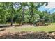 Community playground featuring modern play structures, swings, and benches, perfect for Gathering fun at 4586 Smoke Rise Ln, Marietta, GA 30062
