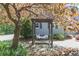 A peaceful covered porch swing among lush greenery and mature trees at 4586 Smoke Rise Ln, Marietta, GA 30062