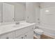 Bright bathroom features a single sink, shower-tub combo, and a well-lit mirror at 1406 Dolcetto Nw Trce # 13, Kennesaw, GA 30152