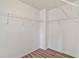 Walk in closet with wood floor and white wire shelves at 1406 Dolcetto Nw Trce # 13, Kennesaw, GA 30152