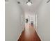 Bright hallway with wood floors leading to a cozy living room with a fireplace at 1406 Dolcetto Nw Trce # 13, Kennesaw, GA 30152
