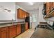 Well-equipped kitchen featuring plenty of cabinet space and adjacent breakfast bar at 1406 Dolcetto Nw Trce # 13, Kennesaw, GA 30152