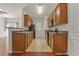 Efficient kitchen with stainless steel appliances, ample counter space, and wood cabinetry at 1406 Dolcetto Nw Trce # 13, Kennesaw, GA 30152
