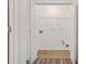 A dedicated laundry room featuring tile floors, connections for a washer and dryer, and a storage shelf at 1406 Dolcetto Nw Trce # 13, Kennesaw, GA 30152