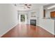 Cozy living room with a fireplace, sliding glass doors to the backyard, and wood floors at 1406 Dolcetto Nw Trce # 13, Kennesaw, GA 30152