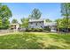 Spacious backyard offering a deck, well-maintained lawn, and mature trees, perfect for entertaining at 1767 Hunters Sw Trce, Lilburn, GA 30047