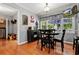 Breakfast nook with black table and chairs and a view to the outdoors at 1767 Hunters Sw Trce, Lilburn, GA 30047