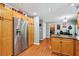 Spacious kitchen with stainless steel refrigerator and adjacent breakfast area with laundry room at 1767 Hunters Sw Trce, Lilburn, GA 30047