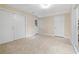 Unfinished basement with tile flooring and multiple white doors at 2185 Arbor Chase, Cumming, GA 30041