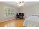 Bedroom with hardwood floors, ceiling fan and bright, natural light at 2185 Arbor Chase, Cumming, GA 30041