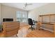 Bedroom with hardwood floors, a ceiling fan and a work desk at 2185 Arbor Chase, Cumming, GA 30041