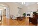 Inviting living room with a fireplace, hardwood floors, and plenty of natural light at 2185 Arbor Chase, Cumming, GA 30041