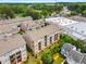 Aerial view of a multi-unit residential complex with manicured lawns, mature trees, and convenient parking at 3592 Parkhaven Pl, Brookhaven, GA 30319