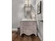 Half bathroom with pedestal sink and decorative mirror at 3592 Parkhaven Pl, Brookhaven, GA 30319