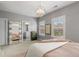 Spacious bedroom showcasing natural light, neutral walls, and a decorative chandelier at 3592 Parkhaven Pl, Brookhaven, GA 30319
