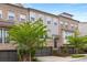 Beautiful multi-story brick townhome featuring an attached two-car garage and professionally landscaped front yard at 3592 Parkhaven Pl, Brookhaven, GA 30319