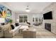 Bright living room with fireplace, large window, and comfortable seating at 3592 Parkhaven Pl, Brookhaven, GA 30319