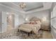 Elegant main bedroom with plush carpet, decorative pillows, and an en-suite bathroom at 3592 Parkhaven Pl, Brookhaven, GA 30319