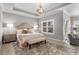 Serene main bedroom with tray ceiling, chandelier, and plush carpeting at 3592 Parkhaven Pl, Brookhaven, GA 30319