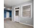 Neutral toned room with a blue accent wall and a large window at 3592 Parkhaven Pl, Brookhaven, GA 30319