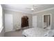Bright bedroom with a ceiling fan, large window, stylish decor, and a cozy bed with plenty of pillows at 3811 Holliwell Pass, Cumming, GA 30040