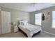 Bright bedroom with carpet flooring, ceiling fan and windows with natural light at 3811 Holliwell Pass, Cumming, GA 30040