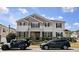 Charming two-story home with a stone facade, well-manicured lawn, and inviting curb appeal at 3811 Holliwell Pass, Cumming, GA 30040