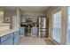 Kitchen features stainless steel appliances, stylish cabinets, and modern countertops at 3811 Holliwell Pass, Cumming, GA 30040
