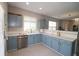 Bright kitchen with stainless appliances, stylish cabinets, and modern countertops at 3811 Holliwell Pass, Cumming, GA 30040