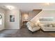 Comfortable living area with neutral colors, stylish decor, hardwood floors, and plenty of natural light from the front door at 3811 Holliwell Pass, Cumming, GA 30040